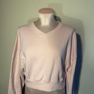 Garage Light Pink Cropped V-Neck Sweatshirt.